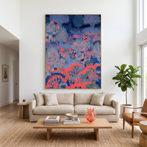 Large original coral forest painting filling a wall in a styled interior