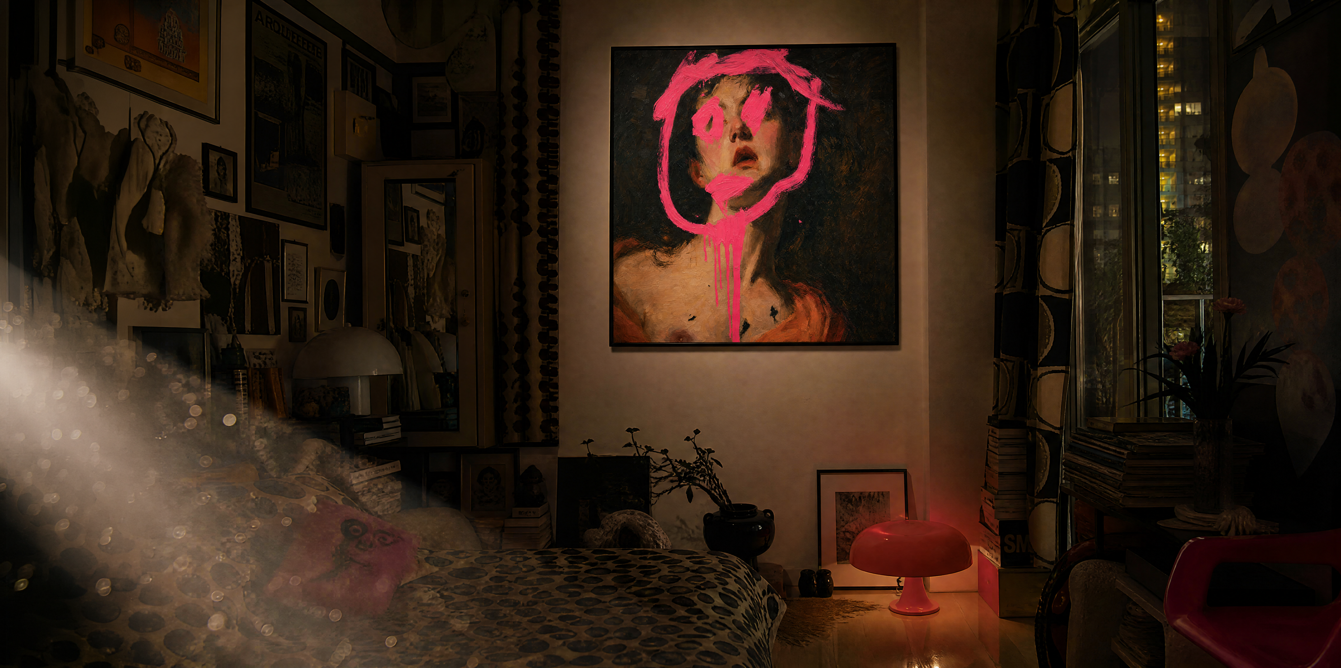 A dark, moody bedroom or gallery-style interior with a large wall art piece centered above a bed. The artwork depicts a woman's face in black and dark brown tones with a vivid hot pink abstract outline and paint-like graphic.