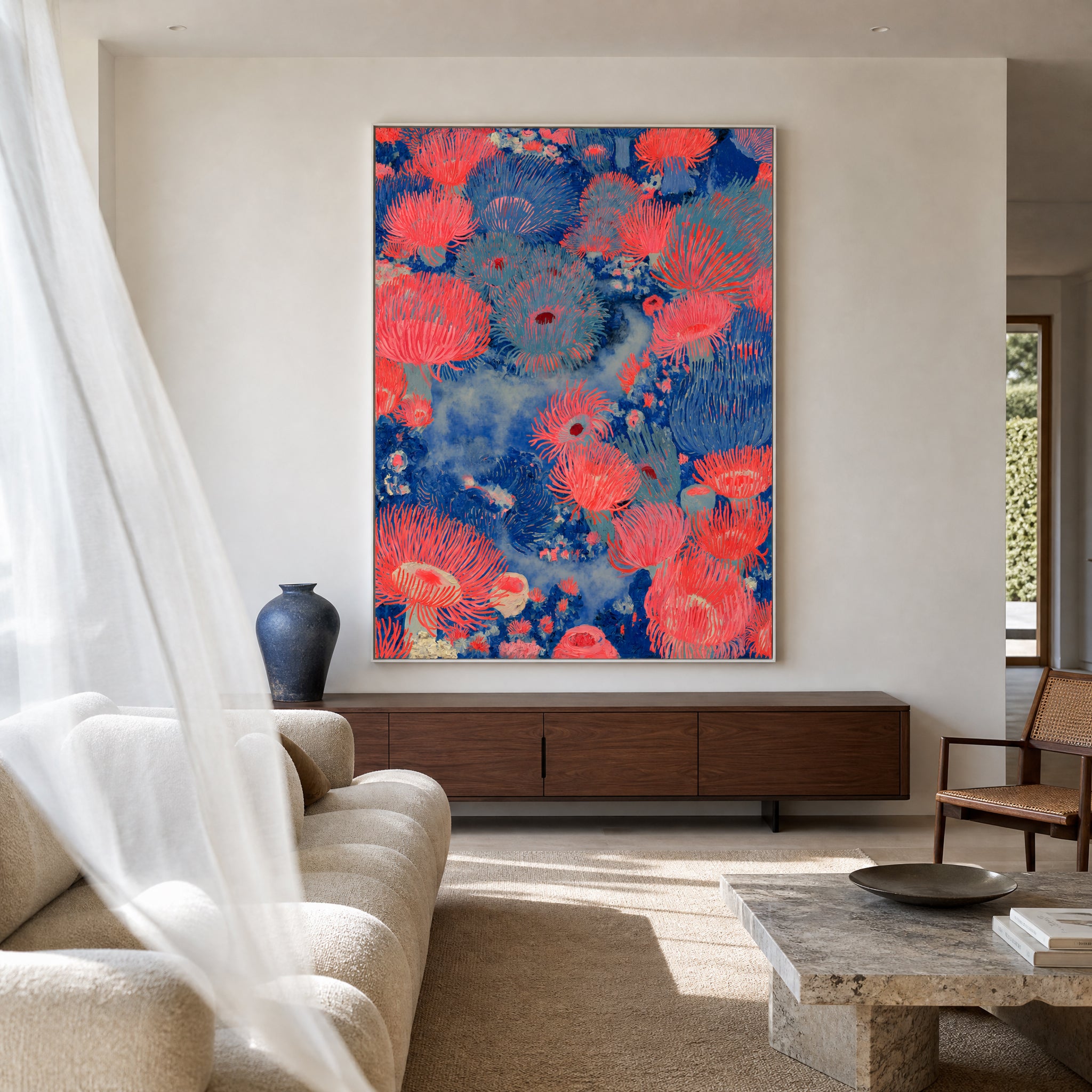 Large original coral reef painting filling a wall in a styled interior
